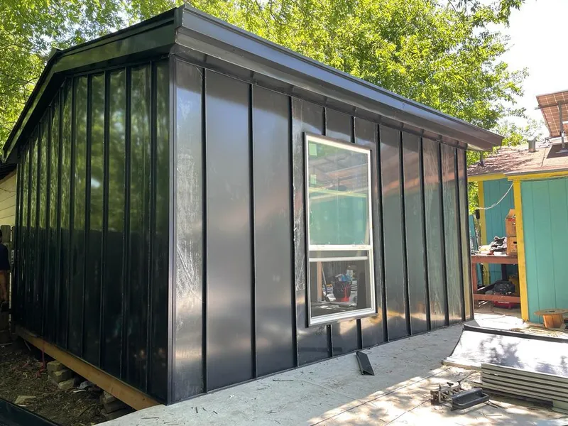 Black standing seam metal wall panels for Roof Inspection in Prairie Grove