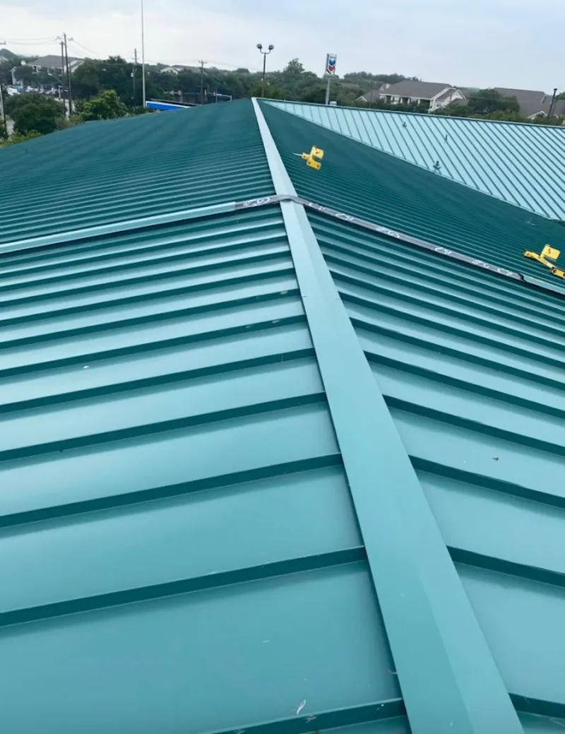 Green commercial metal roof ridge and valley for Metal Roof Repair in Prairie Grove
