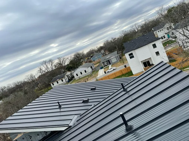 Standing seam metal roof panels with vents for Skylight Repair in Prairie Grove